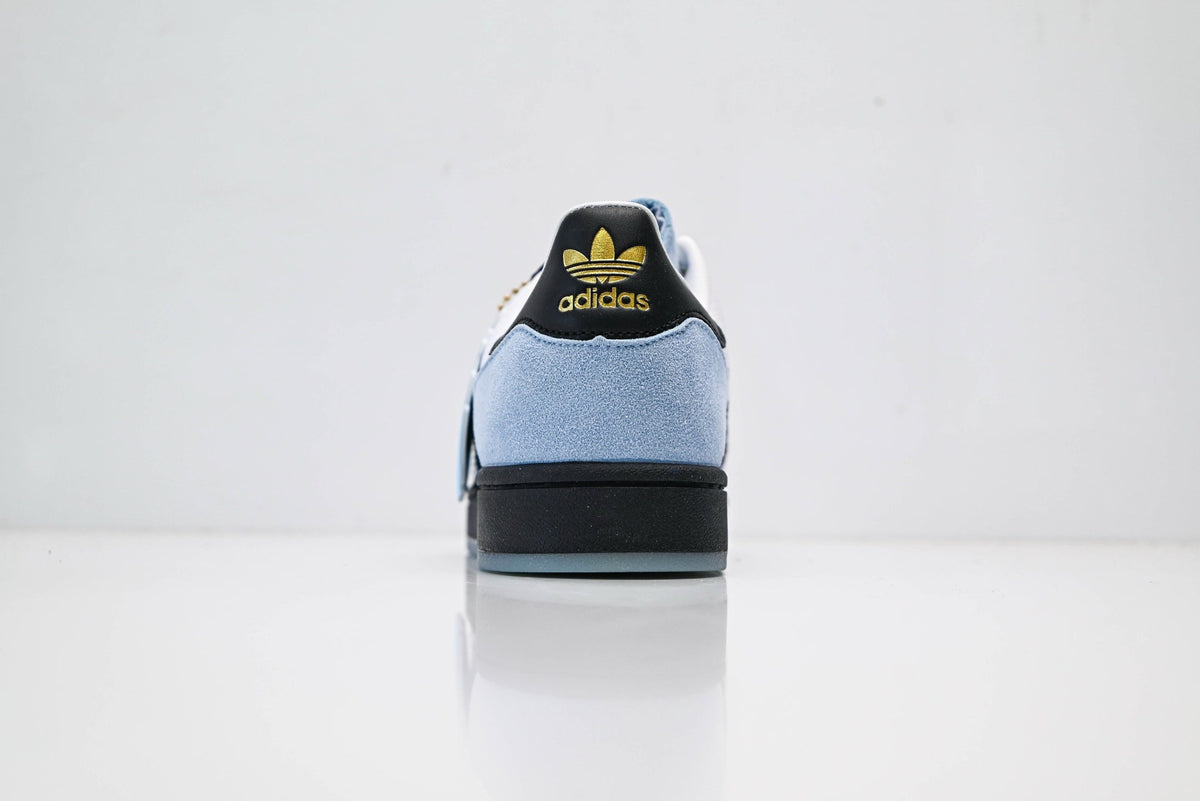 adidas Originals Superstar – Light Blue Upper with White 3-Stripes, Black Heel Tab & Gold Accents